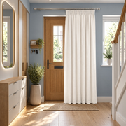 Off-White Heavy Weight Thermal Door Curtain in a Hallway with Soft Blue Walls and a Natural Wood Front Door