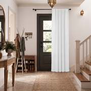 Thermal Door Curtains in a Hallway with Off-White Walls and a Black Front Door