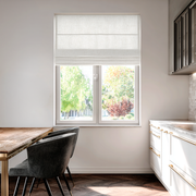 Off-White Linen Kitchen Roman Blinds in a Minimal Kitchen with White Cabinetry - Cotton Lining