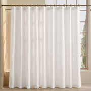 Off White Linen Button-Hole Top Weighted Shower Curtain in front of a Window with Soft Light