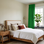 Lime Green Velvet Pencil Pleat Curtains in a Minimal Bedroom with Cream Walls and White Bedding