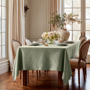 Asparagus Green Rectangular Linen Tablecloth in a Traditional Dining Room with French Windows and Upholstered Chairs