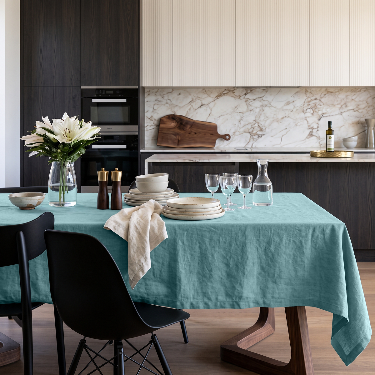 Aquamarine Blue Rectangular Linen Tablecloth in a Contemporary Kitchen with Marble Backsplash and Dark Cabinetry