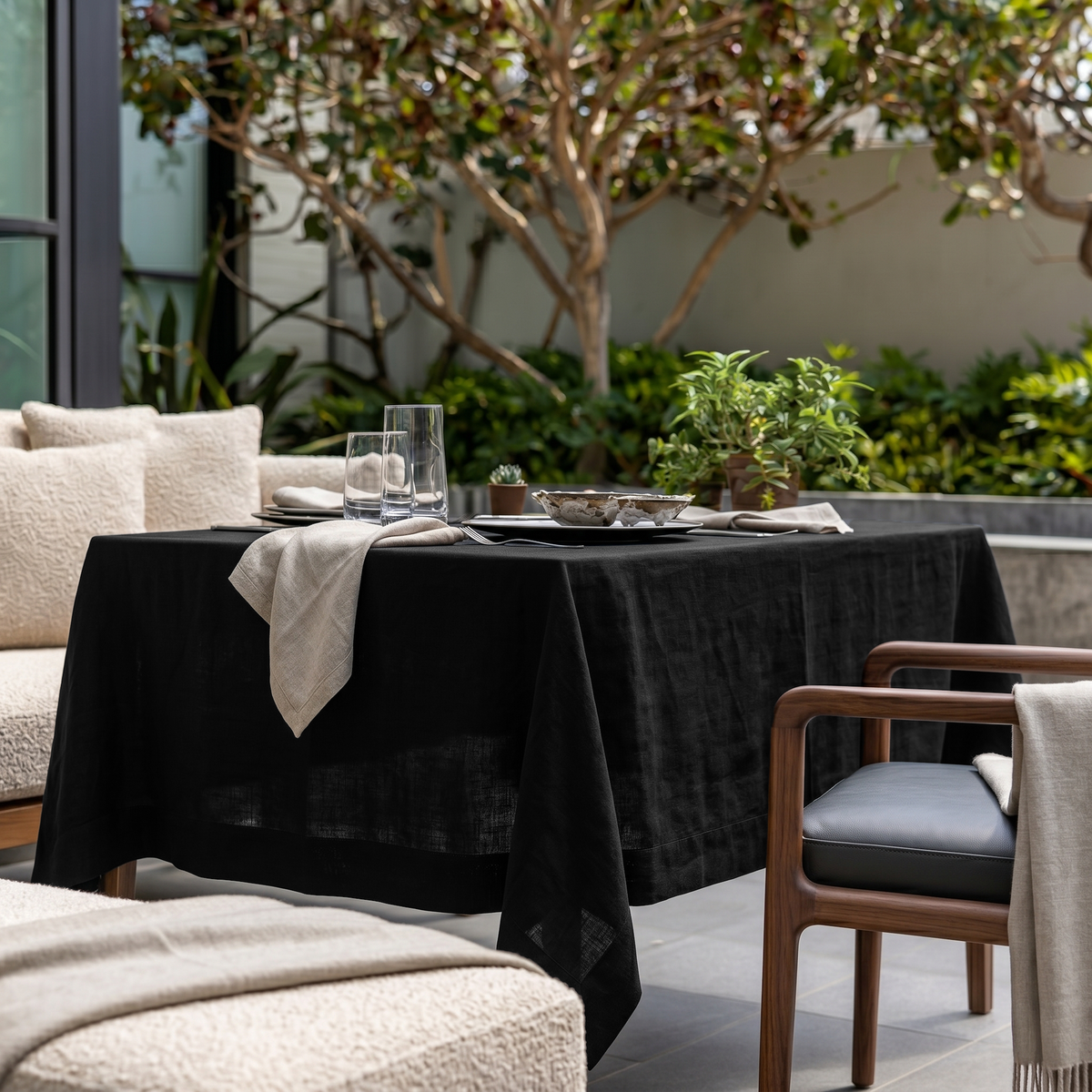 Black Rectangular Linen Tablecloth in a Contemporary Outdoor Dining Area with Wooden Furniture