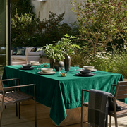 Emerald Green Rectangular Velvet Tablecloth in a Contemporary Patio Dining Area with Wooden Chairs