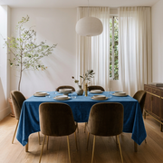 Steel Blue Rectangular Velvet Tablecloth in a Mid-Century Modern Dining Room with Olive Velvet Chairs and Sheer Curtains