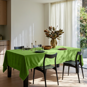 Light Green Rectangular Velvet Tablecloth in a Contemporary Dining Room with Black Chairs and Sheer White Curtains
