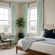 Mint Green Velvet Rod Pocket Curtains in a Modern Bedroom with a Walnut Bed Frame and Navy Accent Pillows