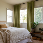 Moss Green Velvet Rod Pocket Curtains in a Minimal Bedroom with White Bedding and a Mustard Pillow
