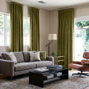 Moss Green Velvet Rod Pocket Curtains in a Contemporary Living Room with a Gray Sofa and Caramel Leather Chair