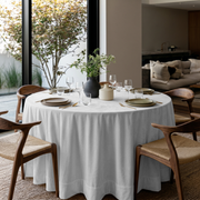 Off-White Velvet Round Tablecloth in a Contemporary Dining Room with Soft Neutral Walls and Walnut Wood Chairs