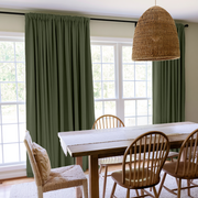 Sage Green Linen Rod Pocket Curtains in a Modern Farmhouse Dining Room with Wooden Chairs and Woven Pendant Light