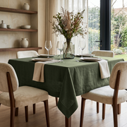 Sage Green Square Linen Tablecloth in a Contemporary Dining Room with Cream Upholstered Chairs