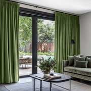 Sage Green Velvet Pencil Pleat Blackout Curtains for Sliding Doors in a Living Room with Grey Walls