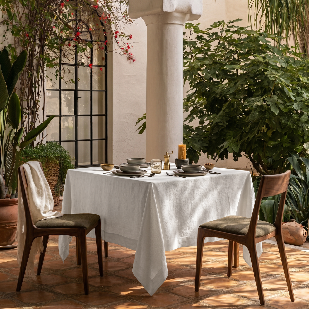 Off-White Square Heavy Weight Linen Tablecloth in a Mediterranean Outdoor Dining Area with Terracotta Tiles