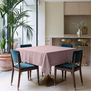 Dusty Pink Square Linen Tablecloth in a Contemporary Dining Room with Teal Upholstered Chairs