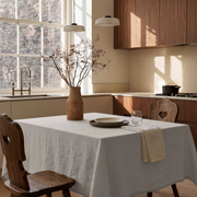 Natural Square Linen Tablecloth in a Warm Contemporary Kitchen with Walnut Cabinetry