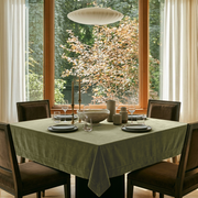 Olive Green Square Velvet Tablecloth in a Mid-Century Modern Dining Room with a Large Wooden-Framed Window