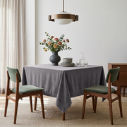Grey Square Velvet Tablecloth in a Minimalist Dining Room with Green Chairs