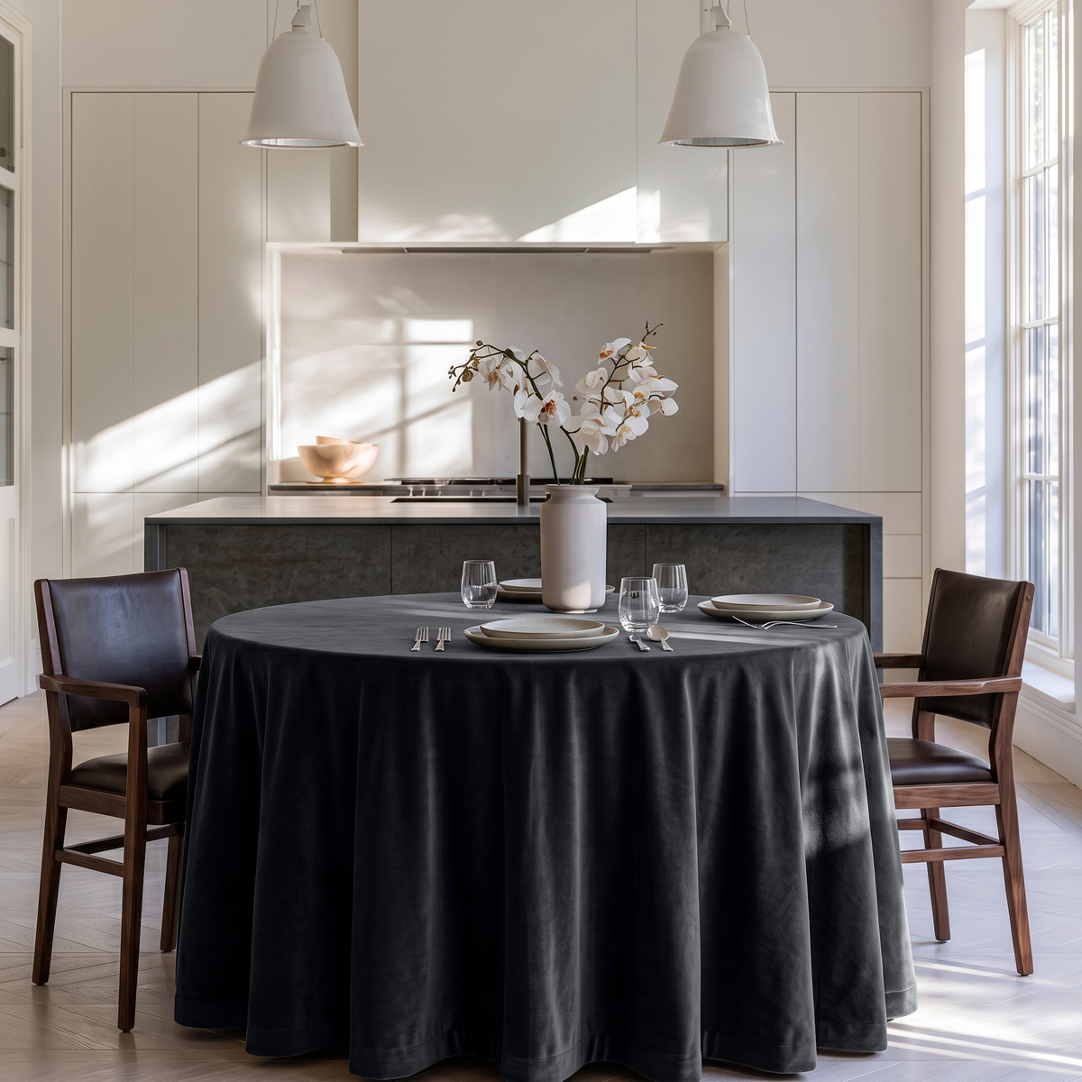 Steel Black Round Velvet Tablecloth in a Modern Kitchen Dining Area with White Cabinetry and Dark Stone Accents