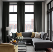Steel Black Velvet Pencil Pleat Blackout Curtains in a Living Room with Grey Walls