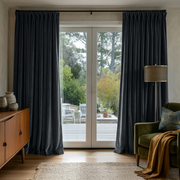 Steel Black Velvet Pinch Pleat Sliding Patio Door Curtains in a Mid-Century Reading Room with a Green Velvet Armchair