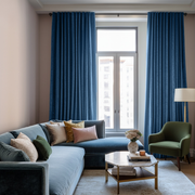 Steel Blue Velvet Back Tab Blackout Curtains in a Living Room with Beige Walls