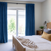 Steel Blue Velvet Back Tab Curtains for Sliding Door in a Bright Bedroom with Cream Walls