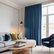 Steel Blue Velvet Pencil Pleat Blackout Curtains in a Living Room with White Walls