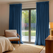 Steel Blue Velvet Pinch Pleat Curtains for Sliding Door in a Cozy Bedroom with Neutral Walls and Warm Wood Furniture