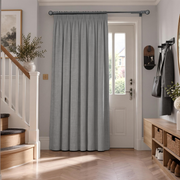 Stone Grey Thermal Door Curtain in a Hallway with Light Grey Walls and a White Wooden Staircase