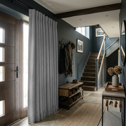 Stone Grey Thermal Door Curtain in a Hallway with Dark Walls and a Wooden Bench