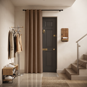 Thermal Door Curtains in a Hallway with Off-White Walls and a Dark Grey Door and Wooden Shoe Bench