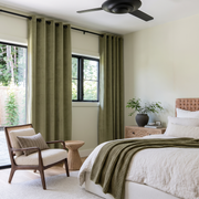 Olive Green Velvet Eyelet Curtains in a Modern Bedroom with Light Cream Walls