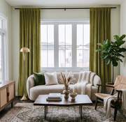 Moss Green Velvet Multitape Soundproof Curtains in a Living Room with a Cream Sofa