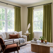 Moss Green Velvet Multitape Thermal Curtains in a Bright Living Room with a Cream Sofa and a Rust Accent Chair