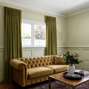 Moss Green Velvet Pencil Pleat Curtains in a Classic Living Room with Sage Walls and a Mustard Sofa
