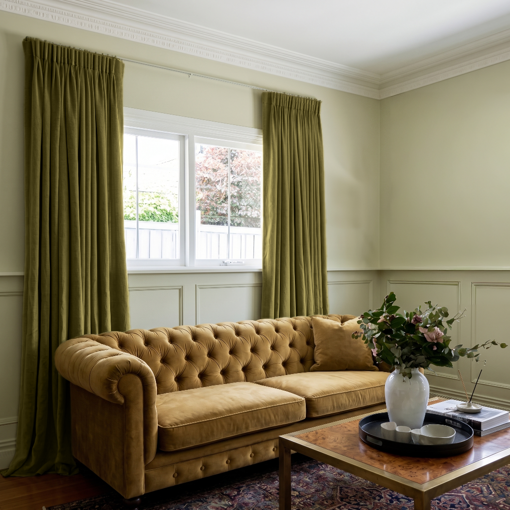 Moss Green Velvet Pencil Pleat Curtains in a Classic Living Room with Sage Walls and a Mustard Sofa
