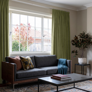 Olive Green Velvet Pencil Pleat Curtains in a Modern Living Room with Greige Walls and a Charcoal Sofa