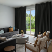 Dark Grey Velvet Pinch Pleat Curtains in a Modern Living Room with Sliding Glass Doors