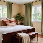 Olive Green Velvet Rod Pocket Curtains in a Warm Traditional Bedroom with Peach-Beige Walls