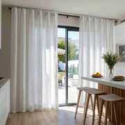 White Linen Back Tab Curtains for Bifold Doors in a Dining Room with Warm White Walls