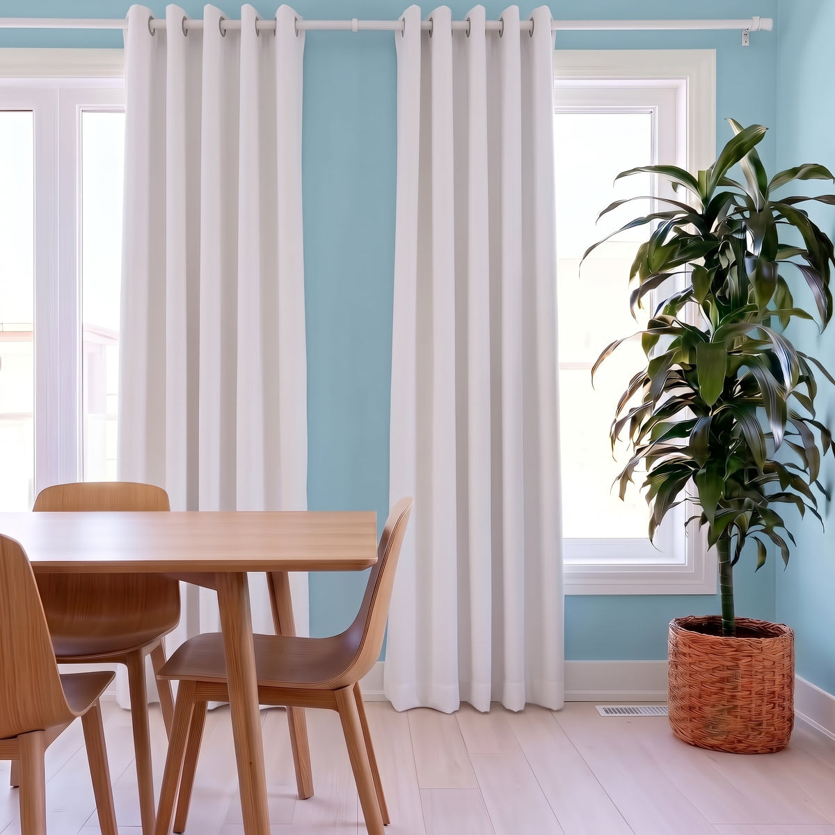 White Linen Eyelets Dining Room Curtain in a Casual Dining Room with Light Blue Walls, a Light Wood Dining Set and a Large Potted Plant - Blackout Lining