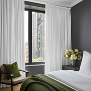 White Linen Pencil Pleat Bedroom Curtains in a Contemporary Bedroom with Charcoal Grey Walls and Olive Green Accents - Blackout Lining